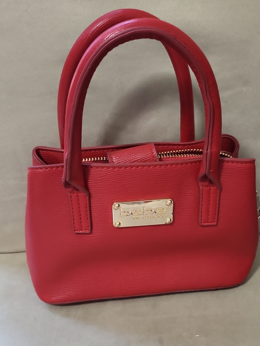 bebe Red Structured Satchel with Gold Plaque
